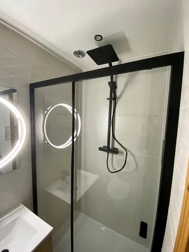 Black-framed shower enclosure with a rainfall head