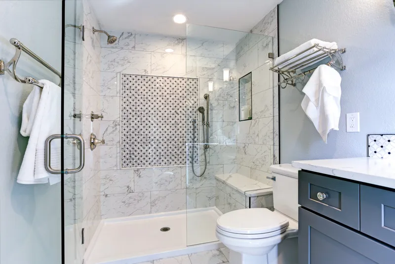 Marble shower with brass fittings