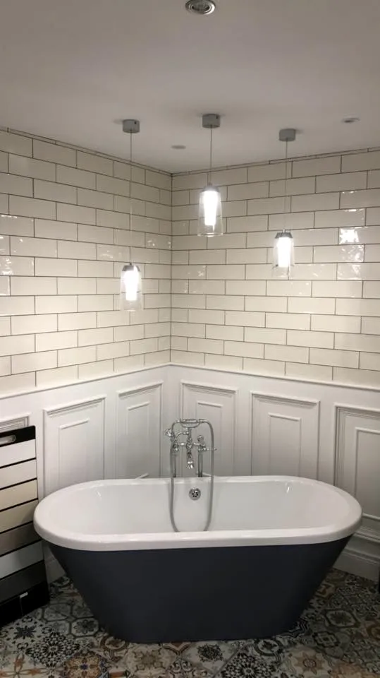 White metro wall tiles above panelling