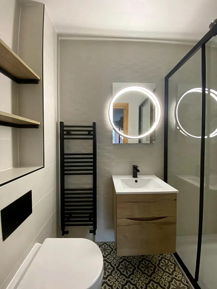 Round LED mirrors and walk-in shower
